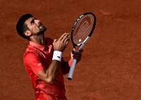 Serbia's Novak Djokovic gestures celebrates his victory over Spain's Carlos Alcaraz Garfia during their men's singles semi-final match on day thirteen of the Roland-Garros Open tennis tournament at the Court Philippe-Chatrier in Paris on June 9, 2023. (Photo by JULIEN DE ROSA / AFP)